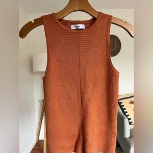 Cute ribbed top. Worn once, slight stain on tag (pictured)